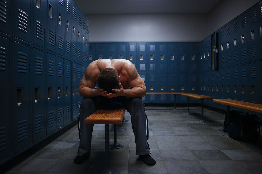 Third Place, Ron Kuntz Sports Photographer of the Year - Jabin Botsford / Western Kentucky UniversityJay Armfield, 29, from Bowling Green, Ky. holds his head in misery after sitting in a sauna to loose 12 pounds of water weight before weigh-in Wednesday at the Bowling Green Athletic Club before the 8th annual Sigma Chi Battle of the Greeks in Bowling Green, Ky. Armfield trained for about 3 months for this fight but didn't make it past the first fight.