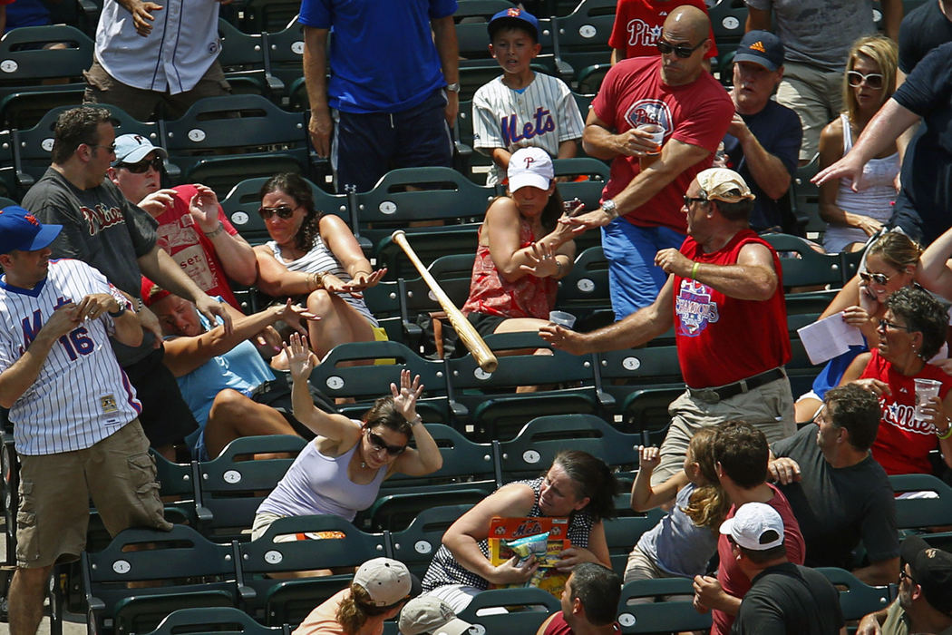 Third Place, Ron Kuntz Sports Photographer of the Year - Jabin Botsford / Western Kentucky UniversityFans dodge New York Mets catcher Anthony Recker's bat as it flies into the stands during the first inning at Citi Field in New York, N.Y. on Saturday, July 20, 2013. The New York Mets won 5-4 against the Philadelphia Phillies.
