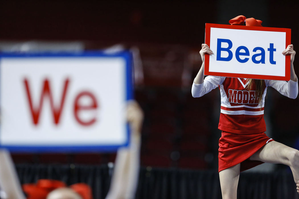 Third Place, Ron Kuntz Sports Photographer of the Year - Jabin Botsford / Western Kentucky UniversityModel high school cheerleaders hold up signs as they perform at the KHSAA Competitive Cheer Championships on Saturday, Feb. 23, 2013, at E.A. Diddle Arena is Bowling Green, Ky.