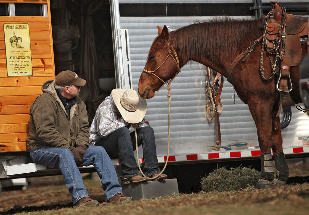 Award of Excellence, Ron Kuntz Sports Photographer of the Year - Chris Russell / The Columbus DispatchSitting on the steps of their horse trailer with her father Jim, Josie Hume  is comforted by her horse Speck after not doing as well as she had hoped in a late winter rodeo in Springfield, Ohio. 