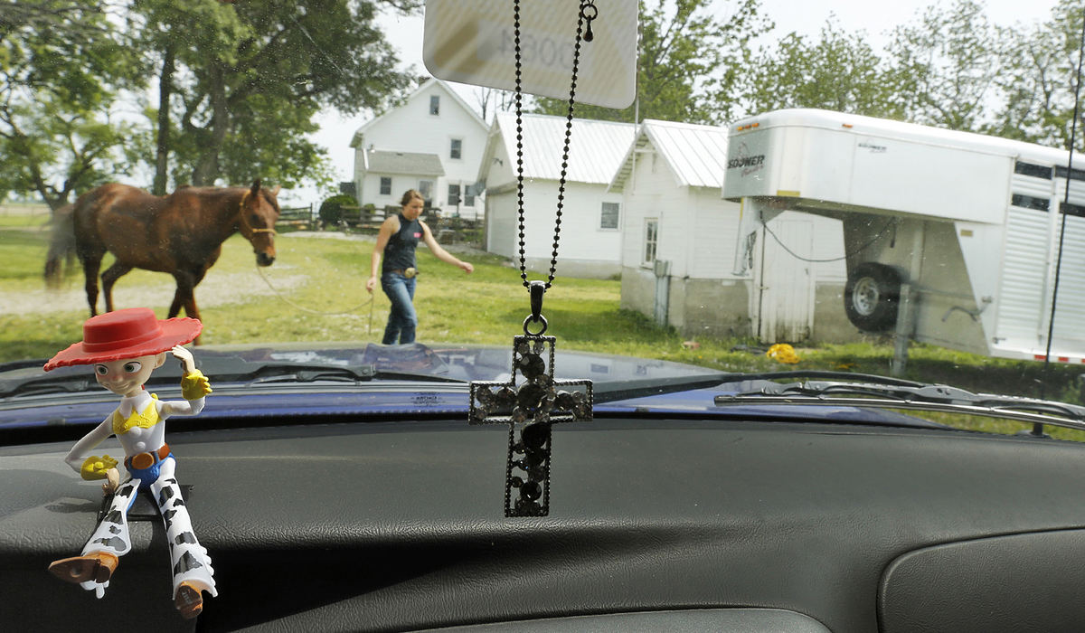 Award of Excellence, Ron Kuntz Sports Photographer of the Year - Chris Russell / The Columbus DispatchA figurine of Jessie the cowgirl featured in the movie Toy Story graces the dashboard of Josie's pickup truck as she takes Speck back to the barn after a practice session at their house.