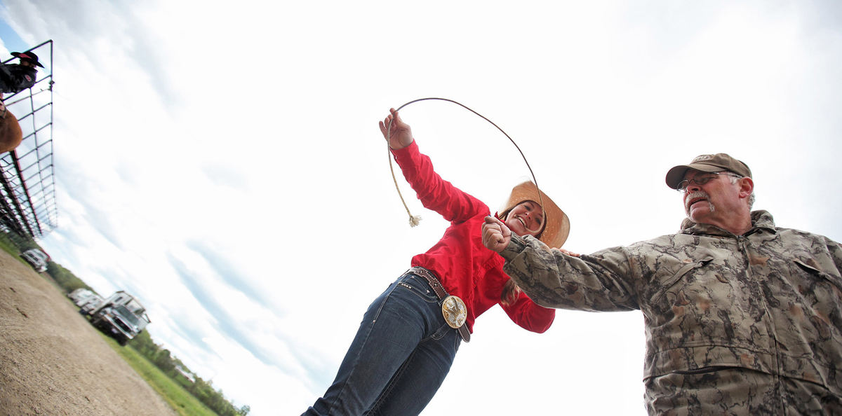 Award of Excellence, Ron Kuntz Sports Photographer of the Year - Chris Russell / The Columbus DispatchJosie Hume uses her father Jim's forearm to practice her goat tying skills before competing in the event in a competition. 