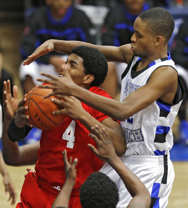 Award of Excellence, Ron Kuntz Sports Photographer of the Year - Chris Russell / The Columbus DispatchSouth High School's #42 Nicholes Drafton denies Centennial's #4 Joseph Thomas as he goes to the basket in their game at South High School on Feb 28, 2013. 