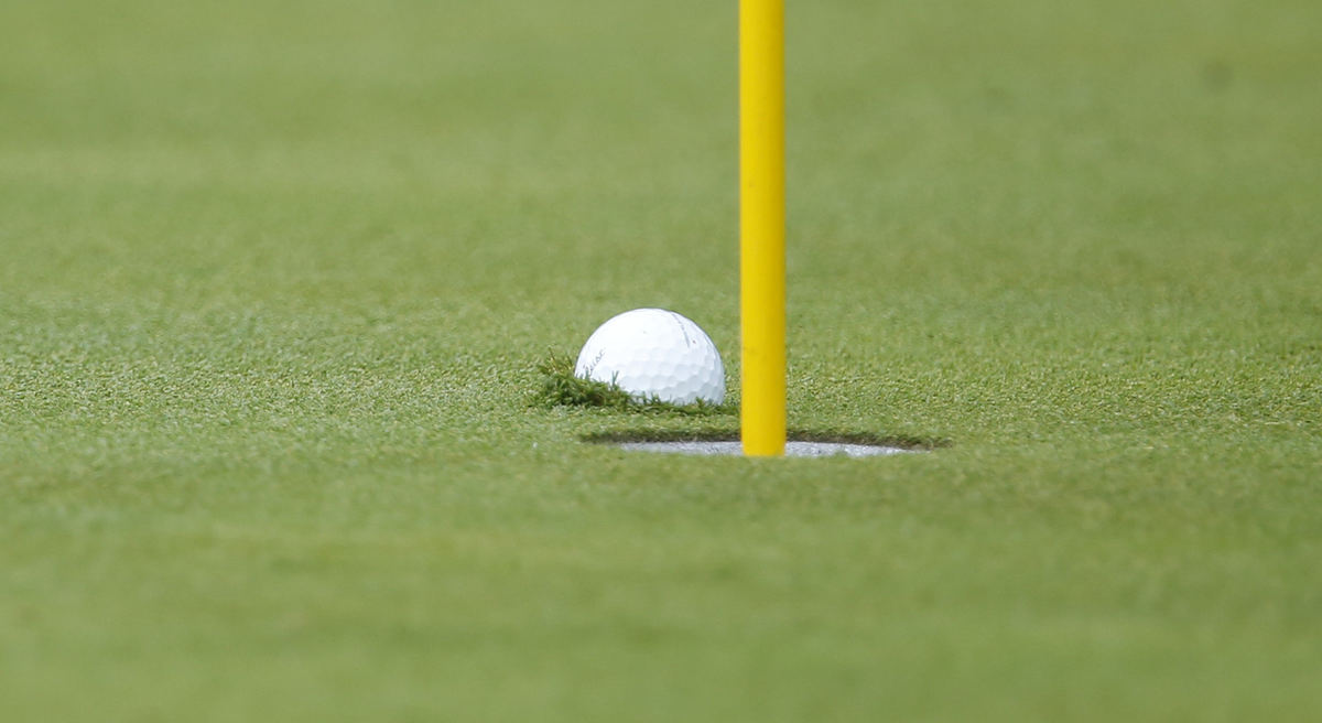 Award of Excellence, Ron Kuntz Sports Photographer of the Year - Chris Russell / The Columbus DispatchMarc Leishman  of the International Team hit this ball just an inch from the cup on 8 where it sank into the muck during the final round of the Presidents Cup.