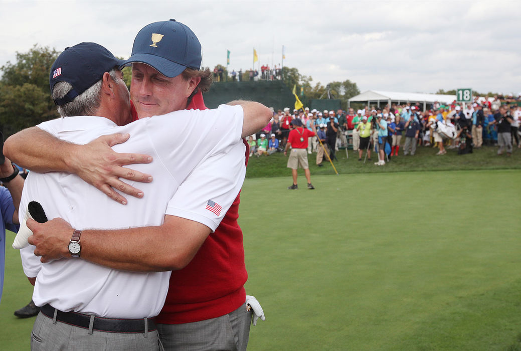 Award of Excellence, Ron Kuntz Sports Photographer of the Year - Chris Russell / The Columbus DispatchPhil Mickelson of the United States Team hugs team captain Fred Couples and celebrates the American's victory over the International Team at the end of the  final round of the President's Cup.  