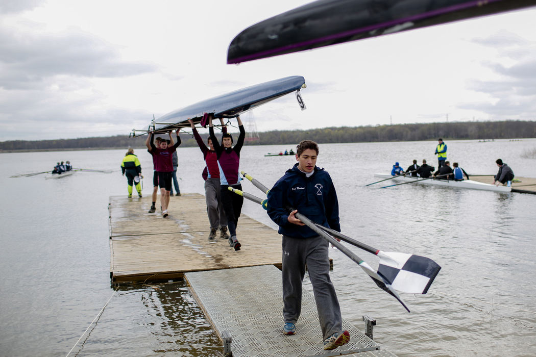 First Place, Ron Kuntz Sports Photographer of the Year - Joshua A. Bickel / ThisWeek Community NewsWesterville Crew's Paul Murdock, center, carries oars back to the staging area after a race during the Hoover Invitational Regatta Apr. 20, 2013 at Hoover Reservoir in Westerville, Ohio.