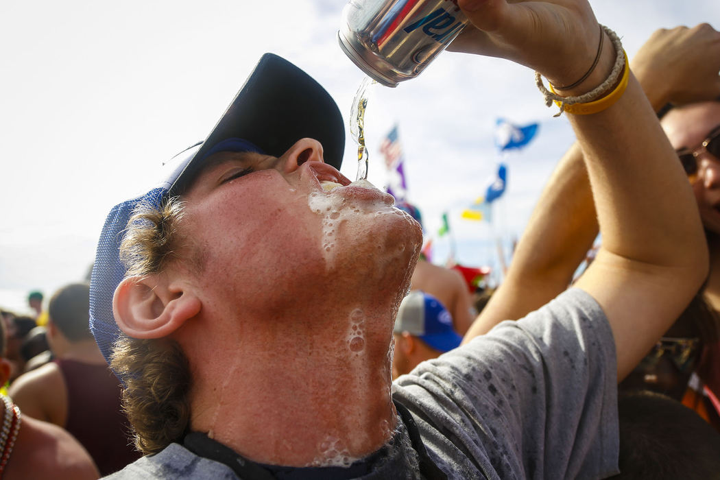 First Place, Student Photographer of the Year - Jabin Botsford / Western Kentucky UniversityA spring breaker chugs a beer as students from around the country congregate to party and have a good time in Panama City Beach, Florida during the 2013 season.
