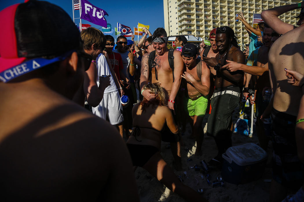 First Place, Student Photographer of the Year - Jabin Botsford / Western Kentucky UniversitySpring breakers crowd around and cheer as a man receives oral sex from a female as students from around the country congregate to party and have a good time in Panama City Beach, Florida.