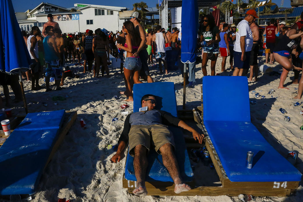 First Place, Student Photographer of the Year - Jabin Botsford / Western Kentucky UniversityA spring breaker lays passed out as students from around the country congregate to party and have a good time in Panama City Beach, Florida during the 2013 season.