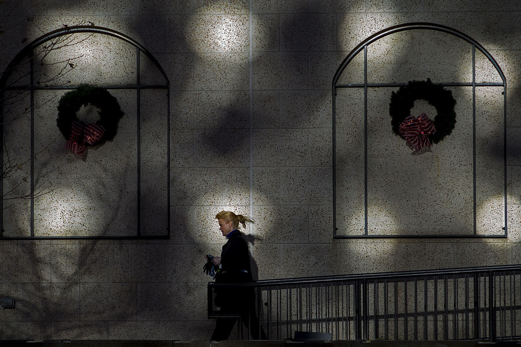 Second Place, Student Photographer of the Year - Alex Holt / University of KentuckyA woman puts on her gloves as she exits the building into the cold in downtown Lexington, KY Wednesday afternoon December 11, 2013.