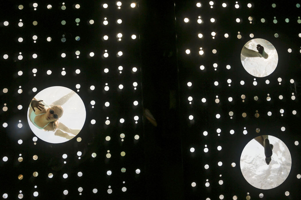 First Place, Pictorial - Jabin Botsford / Western Kentucky UniversityPatrons cool off in the rooftop pool at the Dream Downtown Hotel which features larger glass holes in the pool bottom that go all the way through to the lobby ceiling, providing both a skylight and fish bowl effect at the hotel in the meat packing district in New York, N.Y. on Thursday, July 18, 2013. The temperature reached 98 degrees, which was 14 degrees higher than the average temperature for that day.