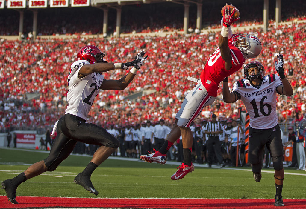 Second Place, Student Photographer of the Year - Alex Holt / University of KentuckySenior Buckeye wide receiver Corey Brown (10) makes a leaping grab over SDSU defensive backs Eric Pinkins (27) and David Lamar (16) for a touchdown in the third quarter of play Saturday afternoon, September 7, 2013. The Buckeyes topped the Aztecs 42-7. 