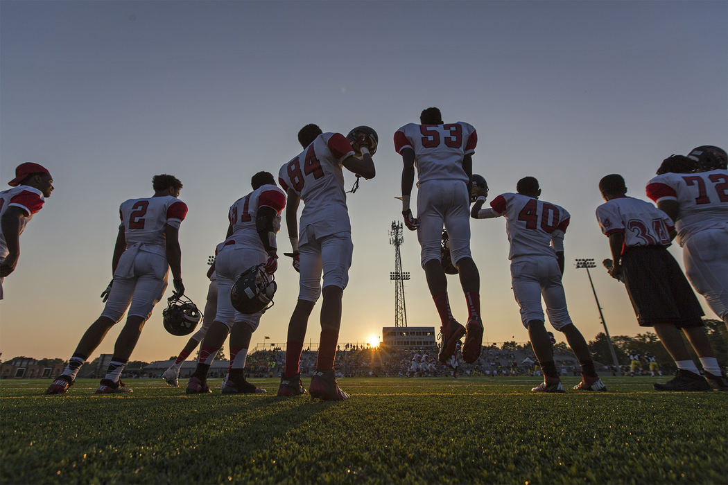 Second Place, Student Photographer of the Year - Alex Holt / University of KentuckyMarion-Franklin High School players get pumped as the first kick-off of the season takes place Friday night, August 30, 2013.