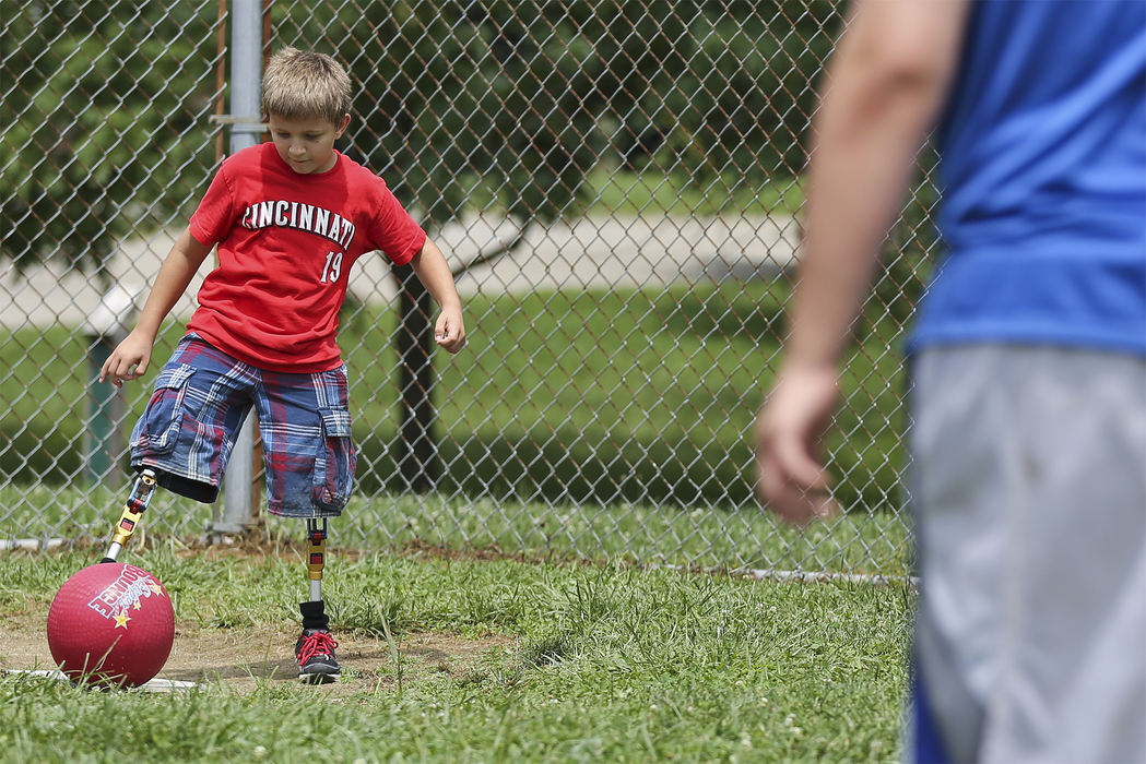 Second Place, Student Photographer of the Year - Alex Holt / University of KentuckyTheo Hardesty, from Lima, Oh, connects with the ball during a game of kickball Sunday afternoon, July 21, 2013. Kickball was one of many events the campers are taking part in at Camp Joy this week. Camp Joy is working with the Amputee Coalition of America to bring children who have amputations or limb differences together and challenge them with fun events such as sports, canoeing, a ropes course, zip-lining, etc. . 