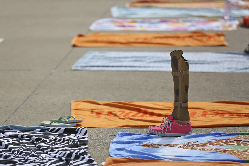 Second Place, Student Photographer of the Year - Alex Holt / University of KentuckyA pair of prosthetic legs lay discarded by the poolside while the campers take refuge from the heat in the pool Sunday afternoon, July 21, 2013. 