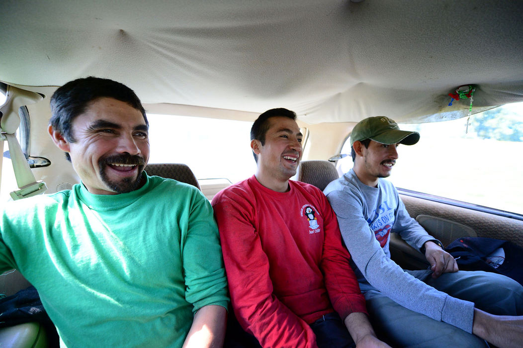 Third Place, Student Photographer of the Year - Logan Riely / Ohio UniversityMoreno Ortiz (from left), Fernando Gomez and Miguel Moreno  ride in a van toward home for a midday lunch break. They interact with each other all day, every day., for up to seven months.
