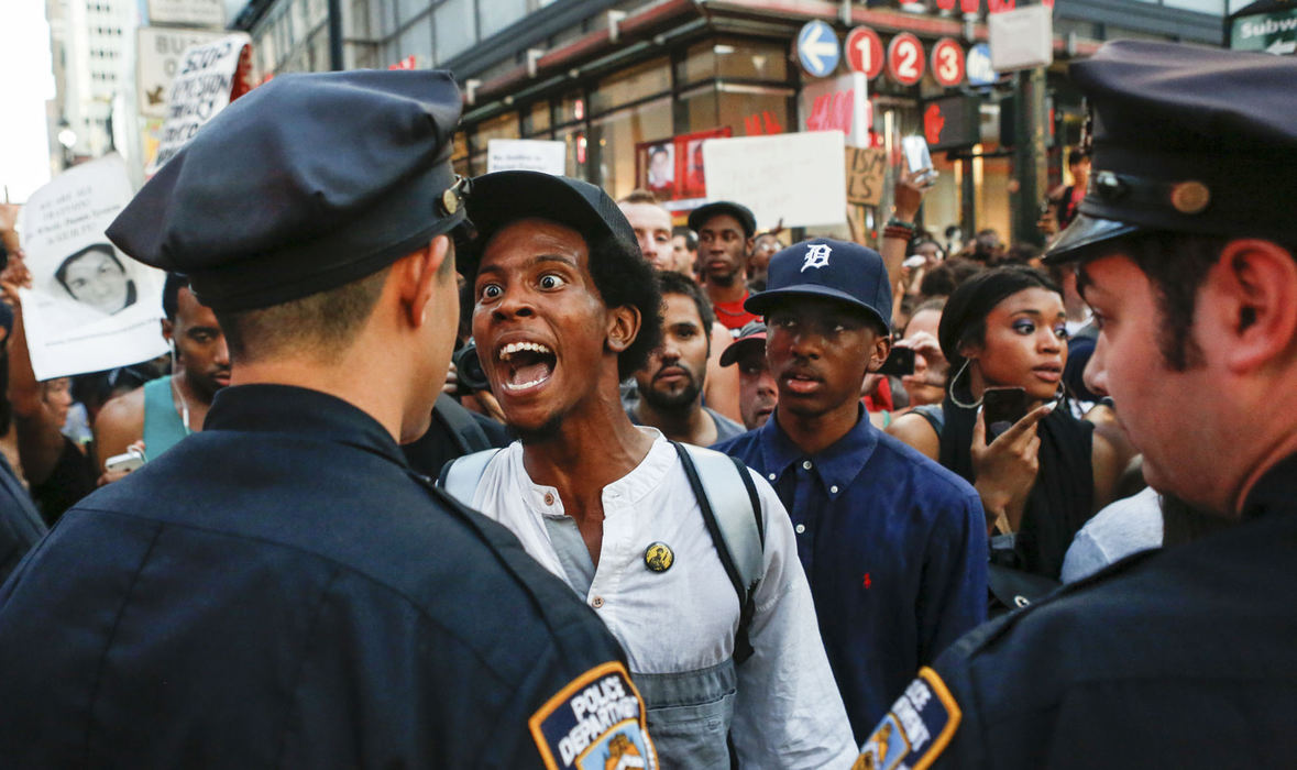 First Place, Student Photographer of the Year - Jabin Botsford / Western Kentucky UniversityA day after George Zimmerman was acquitted of all charges in the shooting death of Trayvon Martin, a man argues with New York City police officers at West 34th Street on July 14, 2013. He and thousands of other protesters who questioned the verdict of the trial blocked traffic as they made their way from Union Square to Times Square.