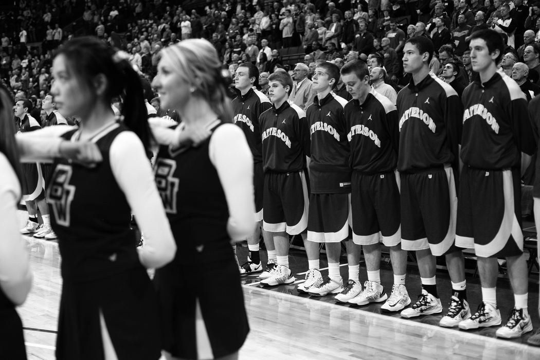 First Place, Sports Picture Story - Joshua A. Bickel / ThisWeek Community NewsThe Bishop Watterson boys basketball team listens during the singing of the National Anthem before their state final against Akron St. Vincent-St. Mary Mar. 23, 2013 at Value City Arena in Columbus, Ohio.