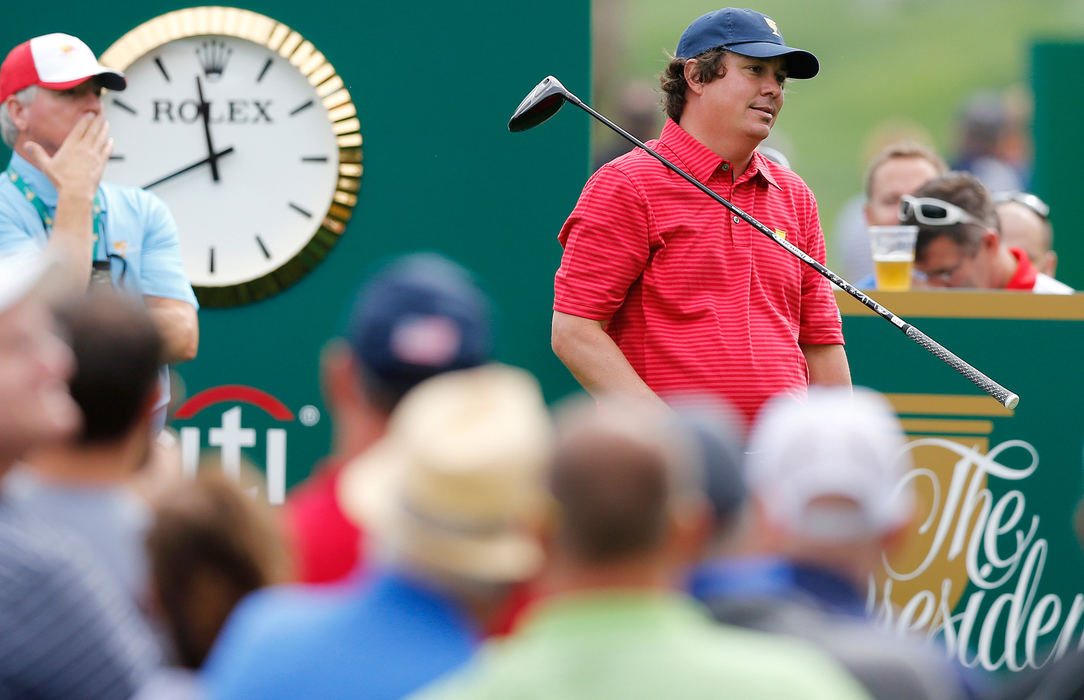 Third Place, Sports Picture Story - Adam Cairns / The Columbus DispatchJason Dufner of the United States Team drops his club after hitting a tee shot on the 15th hole during a practice round for the Presidents Cup at Muirfield Village Golf Club on Oct. 2, 2013. 