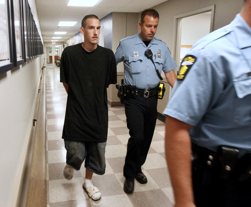 First Place, Team Picture Story - Amy E. Voigt / The (Toledo) Blade Steven King II is walked through the safety building after being arrested in connection with case of missing toddler Elaina Steinfurth.