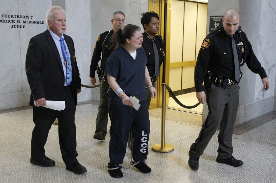 First Place, Team Picture Story - Amy E. Voigt / The (Toledo) Blade Angela Steinfurth cries as she arrives for her hearing in Lucas County Common Please Court in Toledo.  Steinfurth, who was charged with murder in the death of her daughter Elaina, entered an Alford plea.  The Blade/Amy E. Voigt