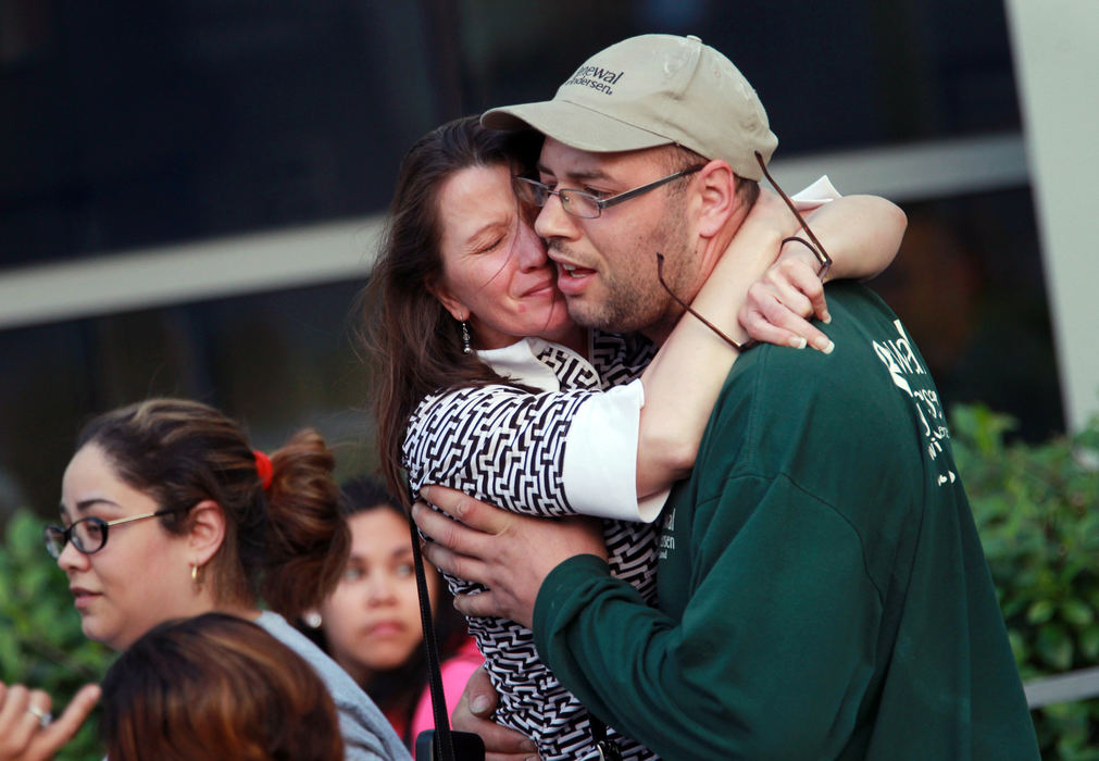 Second Place, Team Picture Story - Gus Chan / The Plain DealerThe three rescued women were taken to MetroHealth Medical Center where a large crowd gathered to celebrate their freedom.  (Gus Chan / The Plain Dealer)