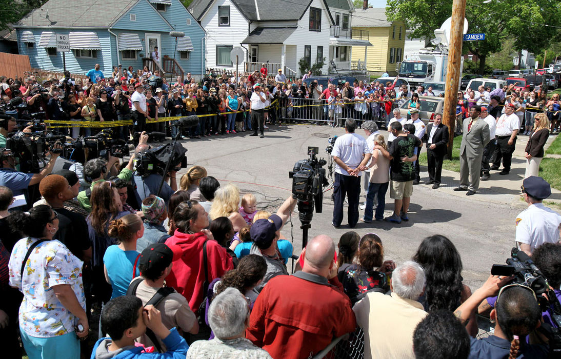 Second Place, Team Picture Story - Marvin Fong / The Plain DealerThe family of Gina DeJesus speaks to neighbors and the media shortly after DeJesus returned home on May 8.  The family asked for privacy to let DeJesus adjust to being home.