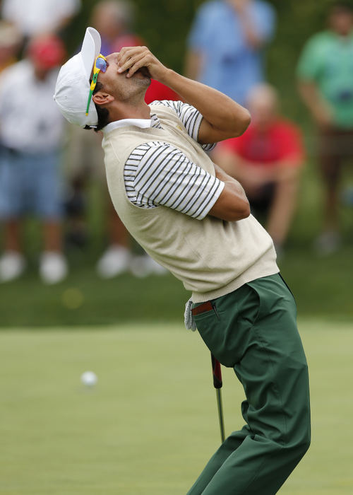 Third Place, Team Picture Story - Adam Cairns / The Columbus DispatchAdam Scott of the International Team reacts to barely missing a putt on the 5th hole during the first round of the Presidents Cup at Muirfield Village Golf Club on Oct. 3, 2013. 