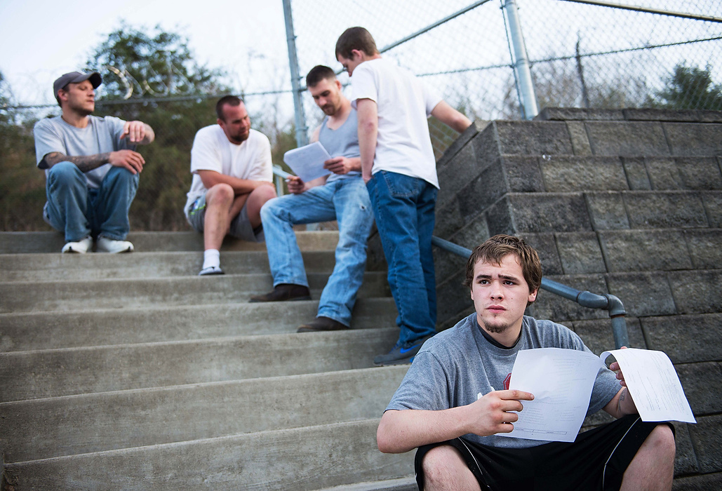 Second Place, Feature Picture Story  - Isaac Hale / Ohio UniversityLucas Reed, right, looks off after reading forms allowing for his early release from the SEPTA Correctional Facility.