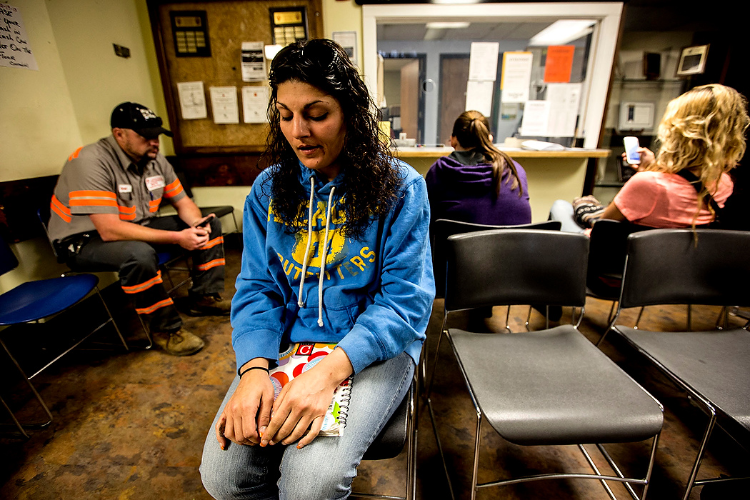 First Place, Feature Picture Story - Jessica Phelps / Newark AdvocateMichele Dobos nervously waits for her first meeting with her parole officer, Chad Smith. She was worried about being sent back to jail because she had missed two court ordered narcotics anonymous meetings. As part of her early release from jail Michele has to participate in meetings for addiction, daily NA or AA meetings and was required to pass drug test every morning. This strict regiment has helped her stay clean, but wears her down and occupies a good part of her day each day.