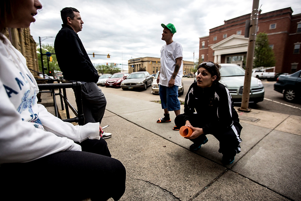 First Place, Feature Picture Story - Jessica Phelps / Newark AdvocateMichele Dobos smokes and talks with other addict friends before entering a court ordered AA meeting. 