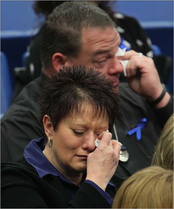 Third Place, News Picture Story - Ed Suba Jr. / Akron Beacon JournalAttendees at the memorial service for Akron Police Officer Justin Winebrenner at the James A. Rhodes Arena become emotional while listening to speakers talk about Winebrenner in Akron.