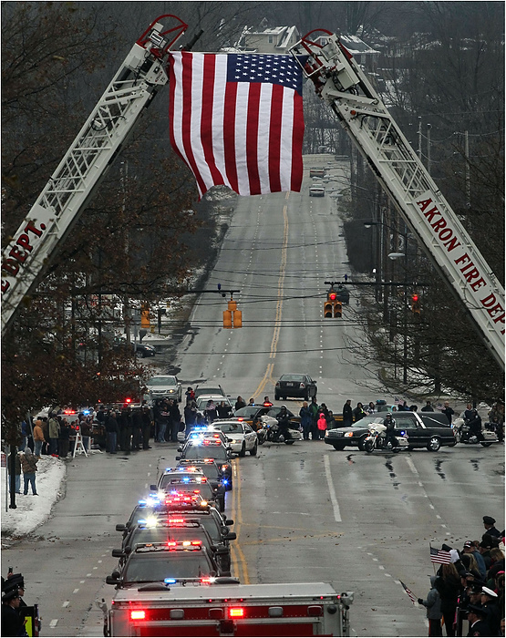 Third Place, News Picture Story - Ed Suba Jr. / Akron Beacon JournalThe motorcade carrying the casket of Akron Police Officer Justin Winebrenner makes it way up Waterloo Rd. for the internment service at Holy Cross Cemetery in Akron.