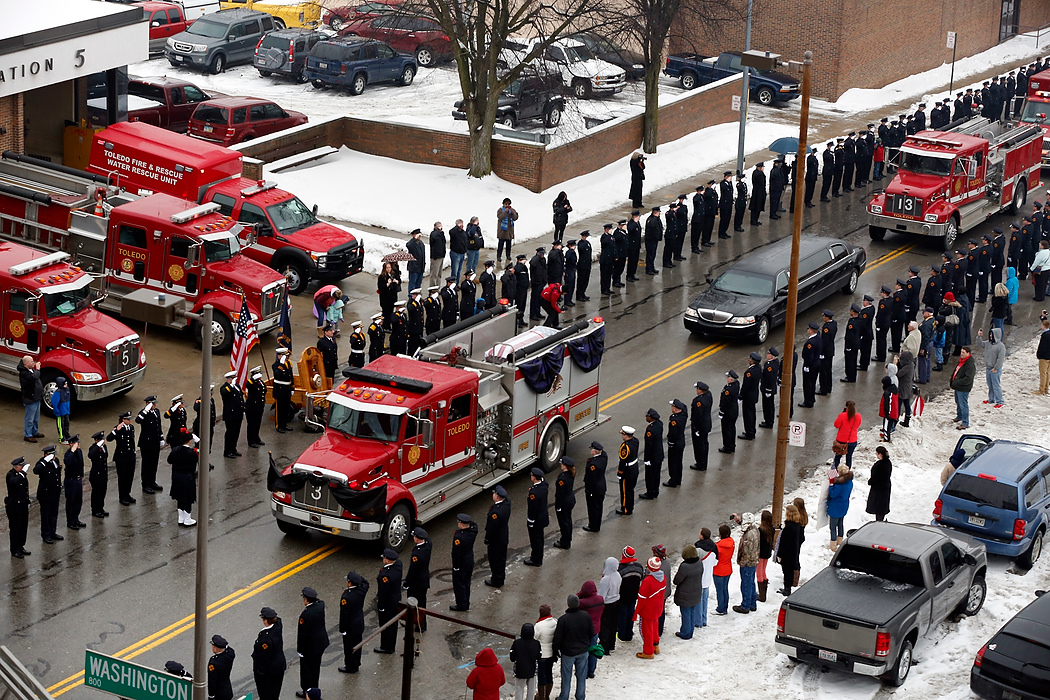 Award of Excellence, News Picture Story - Jetta Fraser / The (Toledo) BladeA Toledo Fire Department truck carries the flag-draped coffin of TFD Pvt. Stephen Machcinski in Toledo.