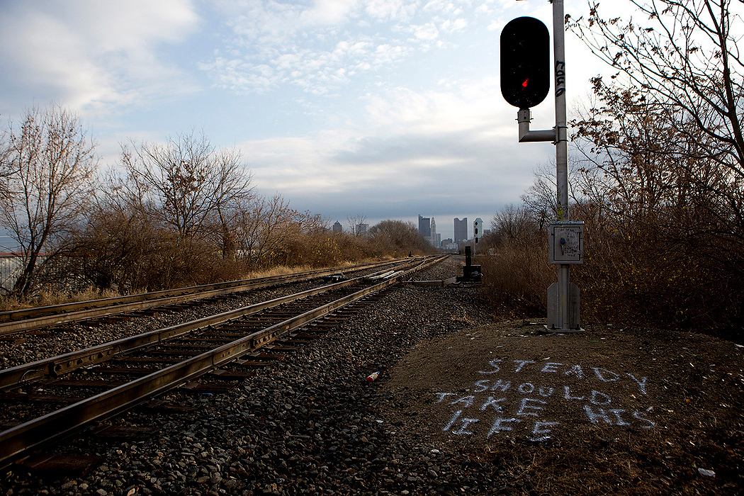 First Place, James R. Gordon Ohio Understanding Award - Jessica Phelps / Newark AdvocateThere are many homeless camps set up alongside the railroad tracks with a view looking into downtown Columbus. The homeless often leave messages for each other along the tracks as a way of communicating with no phones. 