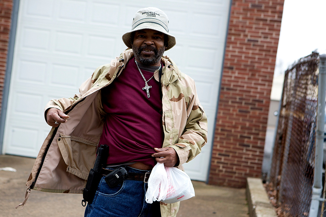 First Place, James R. Gordon Ohio Understanding Award - Jessica Phelps / Newark AdvocateAdrian shows off a baton he says he never leaves his house without because of conditions in the neighborhood. Adrian resides in Sunshine Terrace which is a subsidized housing unit set to be torn down. Some of the residents have been able to obtain papers to move to other housing projects in the city, but have not. 