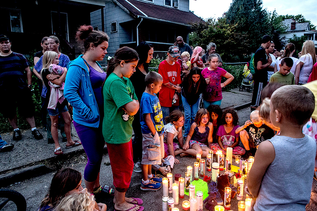 First Place, James R. Gordon Ohio Understanding Award - Jessica Phelps / Newark AdvocateA candlelight vigil is held for Amanda Kirwin, 14 who was fattily shot while standing in front of her home with friends Monday night. Nearly a hundred people showed up for the vigil and placed candles in the street where she was gunned down by a stray bullet. 