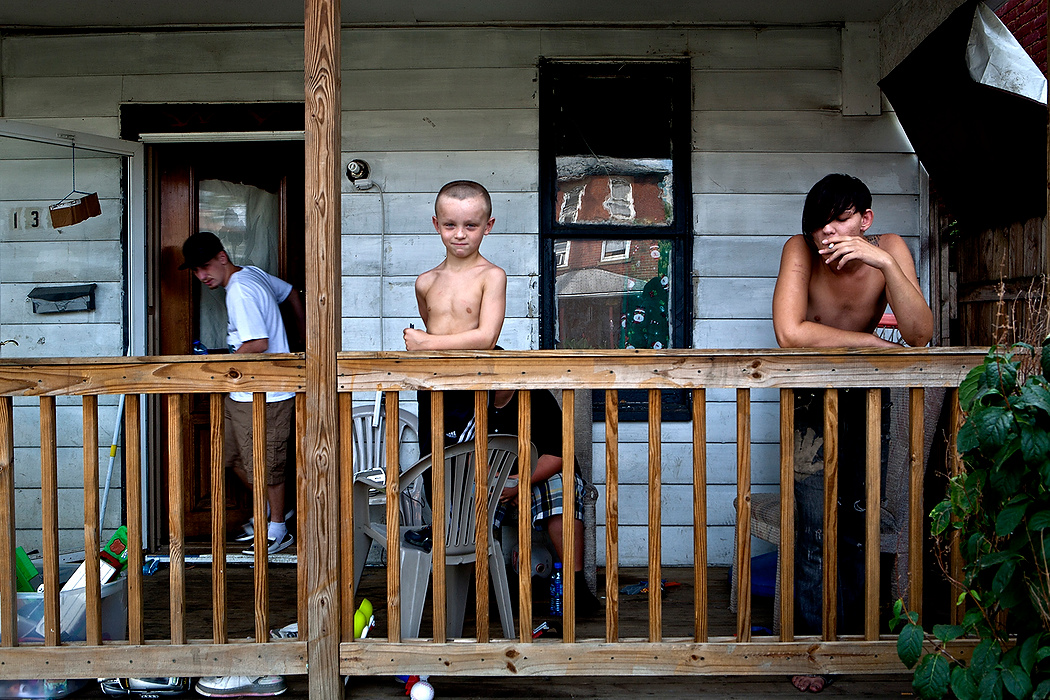 First Place, James R. Gordon Ohio Understanding Award - Jessica Phelps / Newark AdvocateLocal boys stand on their front porch. They live in the eastern part of Franklinton, which is mostly comprised of abandoned warehouses. The city of Columbus is focusing its efforts on converting this part of the neighborhood into an artist district with studios, bars and restaurants.