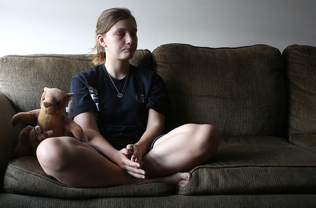 Second Place, James R. Gordon Ohio Understanding Award - Brooke LaValley / The Columbus DispatchAlyssah Munson cries as she remembers the death of her son Andrew Alan Edwin Roth at just six days old during an interview in her home in Columbus, Ohio on July 30, 2014. Andrew died due to complications from a genetic defect called Anencephaly which is caused by a lack of folic acid. A plush kangaroo sitting next to her plays a recording of the heartbeat of her son, which doctors were able to capture on audio before he died. 