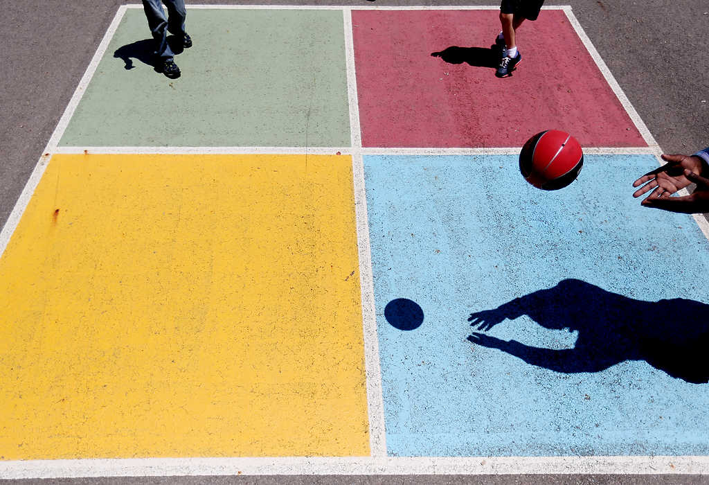 First Place, Pictorial - Courtney Hergesheimer / The Columbus DispatchKids in the Clintonville Resource Center, summer program, "Kids Club" play four-square, on the Clinton Elementary Schools playground.