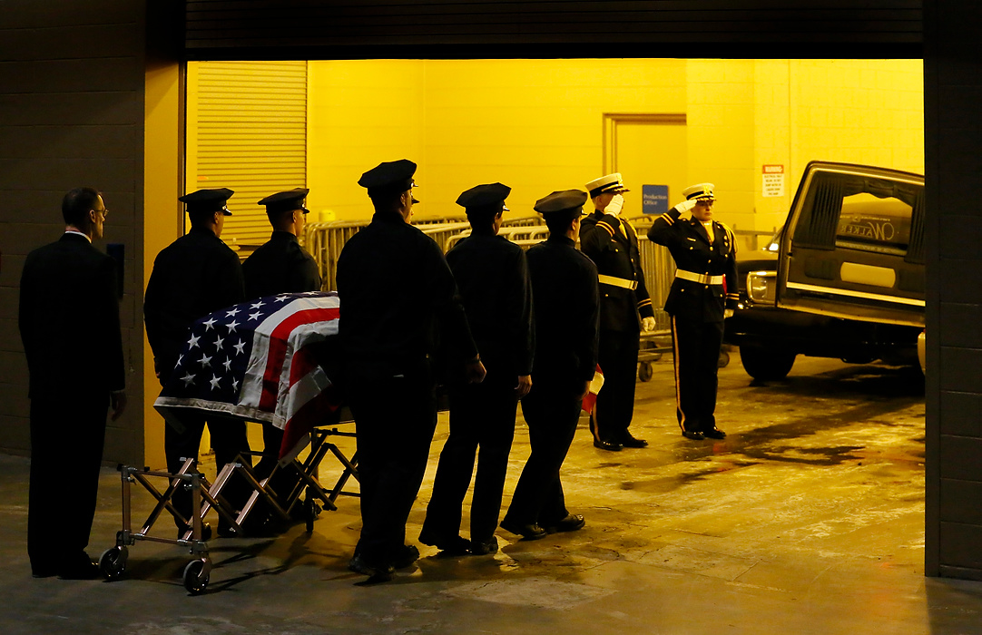 Third Place, Photographer of the Year - Large Market - Andy Morrison / The (Toledo) BladeThe casket of James Dickman is escorted out following the Last Alarm funeral service at SeaGate Convention Centre for Toledo firefighters Stephen Machcinski and James Dickman.