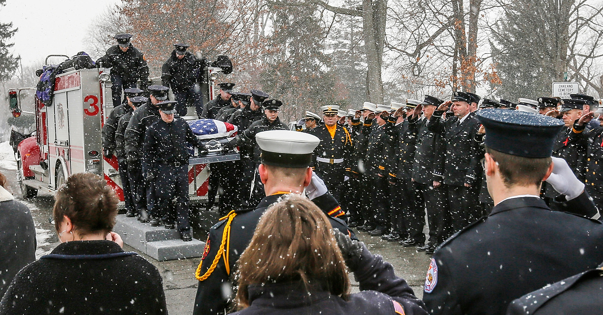 Third Place, Photographer of the Year - Large Market - Andy Morrison / The (Toledo) BladeFirefighters salute as the casket containing Toledo firefighter James Dickman arrives at Oakland Cemetery in Sandusky.