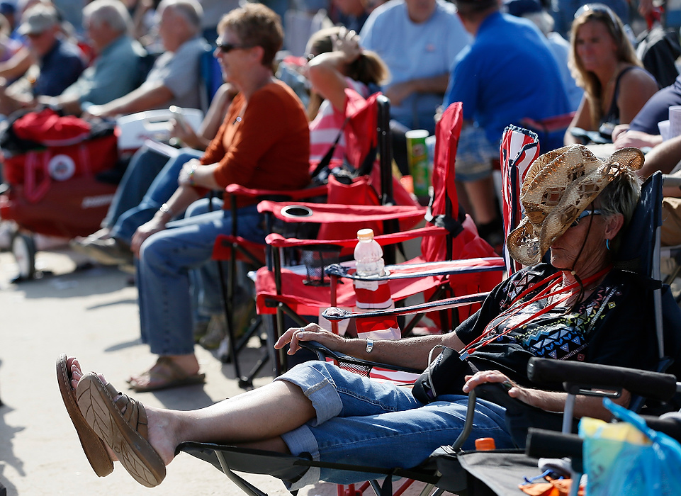 First Place, Photographer of the Year - Large Market - Eamon Queeney / The Columbus DispatchA race fan takes a nap under her cowboy hat before the 13th race during the 69th running of the Little Brown Jug at the Delaware County Fairgrounds.