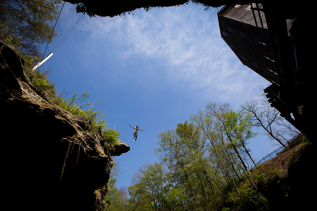 First Place, Photographer of the Year - Large Market - Eamon Queeney / The Columbus DispatchA man, who wished not to be identified for legal purposes, leaps off the cliffs into a deep pool at the Rock Mill on the Hocking River in Fairfield County as he swims with friends to cool off. Signs read no trespassing but jumpers still come to take a terrifying leap into the cool waters. The man said he comes to swim here every summer and this was his first time this year. 