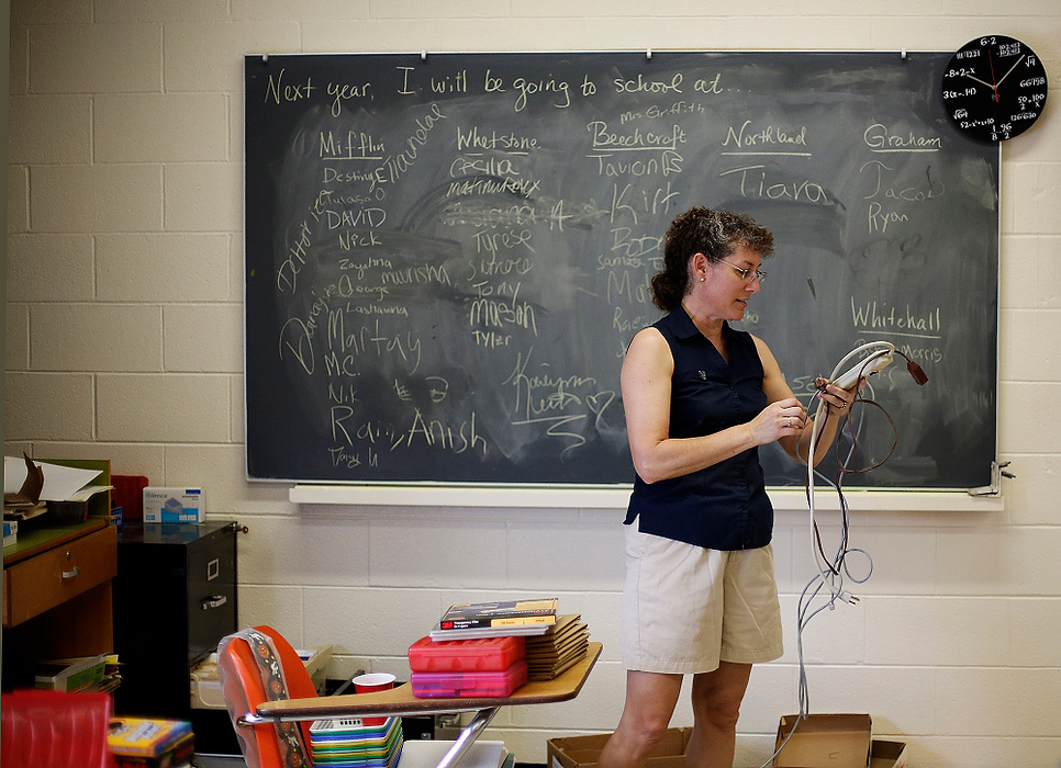 First Place, Photographer of the Year - Large Market - Eamon Queeney / The Columbus DispatchMath teacher and 30-year veteran of Brookhaven High School, Cynthia Beck packs up her classroom as she gets ready to make the move into retired life.