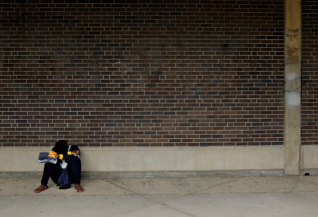 First Place, Photographer of the Year - Large Market - Eamon Queeney / The Columbus DispatchSenior Jerrica Stephens waits for the last bus to take her home outside of Brookhaven High School. This marked the final day of school for Brookhaven ever.  