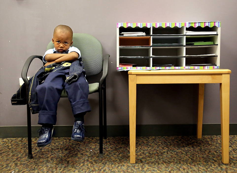 Second Place, Photographer of the Year - Large Market - Lisa DeJong / The Plain DealerKindergartner Tayson King, 5, waits in the principal's office for his grandmother to pick him up after his first day of school at Harvey Rice Elementary School.