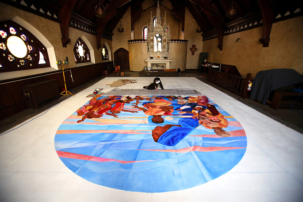 Second Place, Photographer of the Year - Large Market - Lisa DeJong / The Plain DealerThe gessoed canvas is nailed to the floor to prevent shrinking. Mother Mary Thomas, 81, has always thought she has the world's greatest art studio. She works alone and in silence inside the upper chapel at the Church of the Conversion of St. Paul, a Gothic marvel originally built for an Episcopalian congregation in 1875. It is also the only spot where she could work on her 30 x16 mural that she has titled "Our Lady of the Blessed Sacrament and the Communion of Saints".  She hopes to present the mural to the pope when he comes to the states in September. 