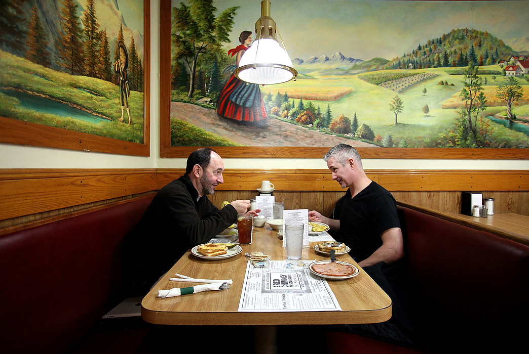 Second Place, Photographer of the Year - Large Market - Lisa DeJong / The Plain DealerOn their first working day together, Cleveland City Councilman Tony Brancatelli, left, tries to get to know convicted felon Blaine Murphy, right, during lunch at his favorite Polish spot in Slavic Village called The Red Chimney.  Judge Richard McMonagle released Murphy to complete his 3,000 of community service with Councilman Brancatelli serving as his de facto probation officer. Brancatelli vocally testified against Murphy as a careless carpetbagger who greedily scooped up properties in the neighborhood, only to let them rot. Brancatelli grew up in the Slavic Village neighborhood and gave Murphy his first tour today and will work with Murphy closely throughout his community service. 