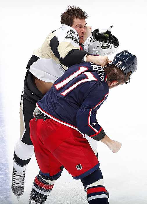 First Place, Photographer of the Year - Large Market - Eamon Queeney / The Columbus DispatchPittsburgh Penguins right wing Steve Downie (23) and Columbus Blue Jackets center Brandon Dubinsky (17) land punches as they fight in the second period of a game at Nationwide Arena in Columbus. At the end of the second period the Columbus Blue Jackets were tied with the Pittsburgh Penguins 1 - 1.